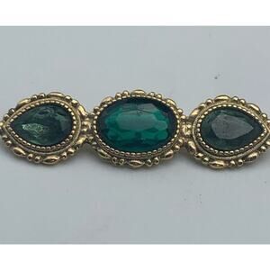 Vintage "1928 Jewelry” Faux Emerald Rhinestone Gold Tone Bar Brooch